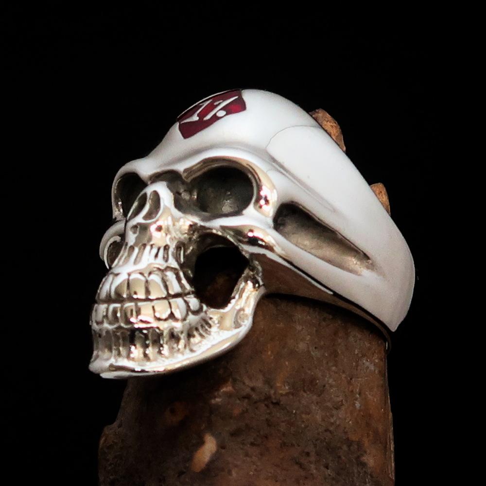 Mirror polished Men's Sterling Silver Outlaw Biker Ring featuring a skull design with red enamel accents, showcasing its high-quality craftsmanship.