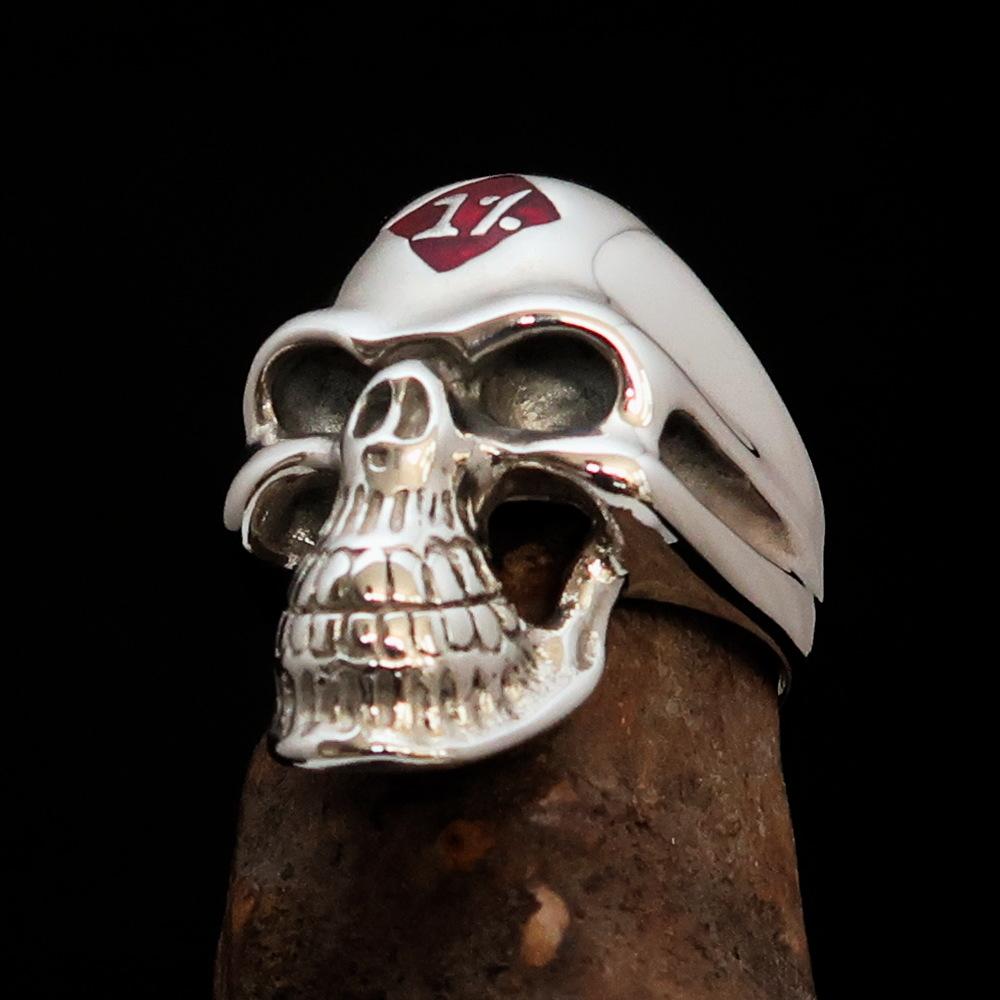 Mirror polished Men's Sterling Silver Outlaw Biker Ring featuring a skull design with red enamel accents, showcasing its high-quality craftsmanship.