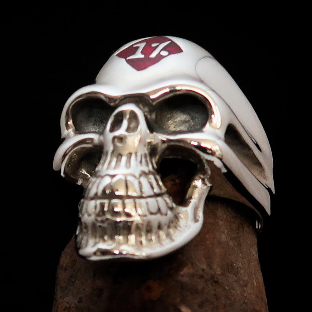 Mirror polished Men's Sterling Silver Outlaw Biker Ring featuring a skull design with red enamel accents, showcasing its high-quality craftsmanship.