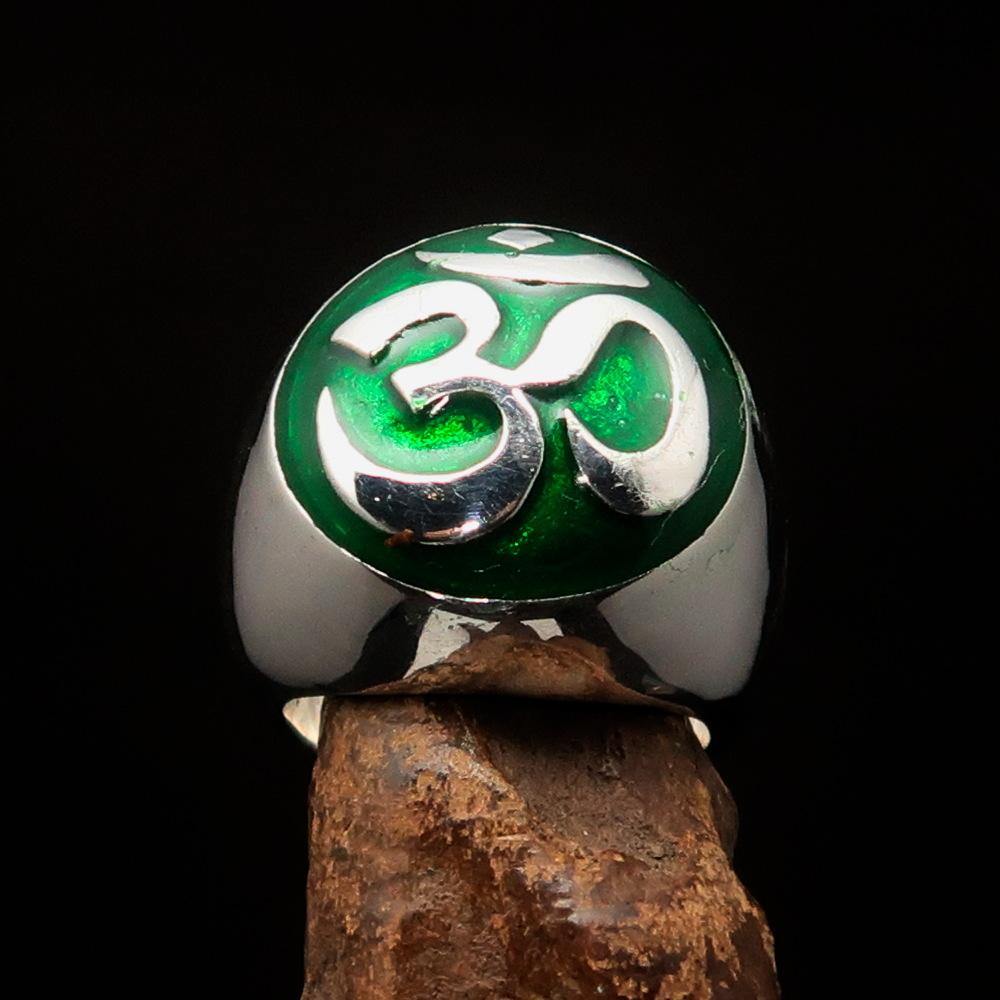 Men's Buddhist Ring made of sterling silver featuring a green Aum symbol, high polished with enamel finish.