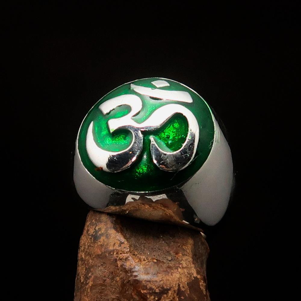 Men's Buddhist Ring made of sterling silver featuring a green Aum symbol, high polished with enamel finish.