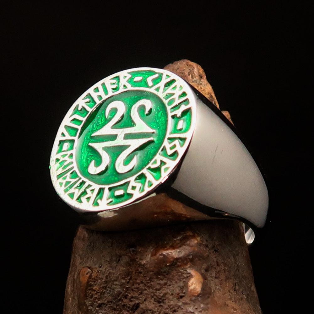 Men's ancient green Viking runes ring made of sterling silver with high polish and enamel finish, showcasing intricate rune designs.