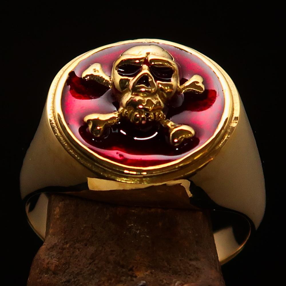 Men's Pirate Ring featuring Jolly Roger design with crossed bones and red enamel, crafted from high polished solid brass.