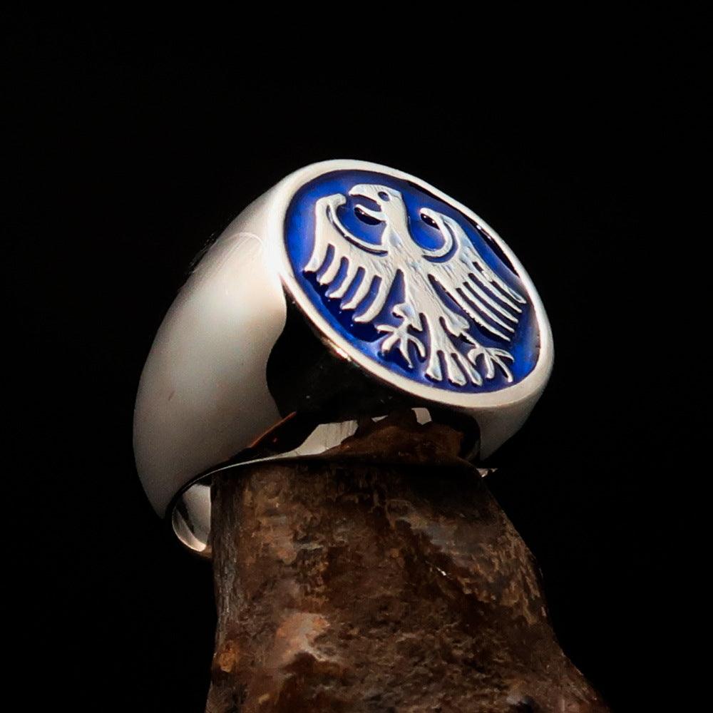 Men's Seal Ring in sterling silver featuring a blue German Eagle design, showcasing intricate craftsmanship and a polished finish.