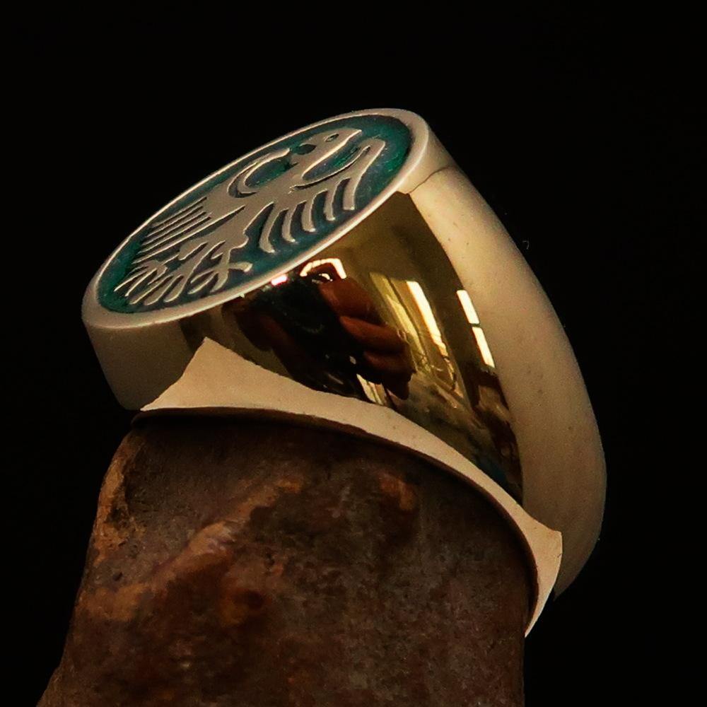 Men's Seal Ring made of solid brass featuring the German Eagle design with green enamel accents, showcasing intricate craftsmanship.