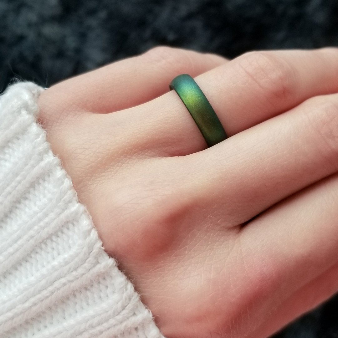 Northern Lights Green Breathable Silicone Ring showcasing its sleek bevel design and comfortable fit, suitable for both men and women.