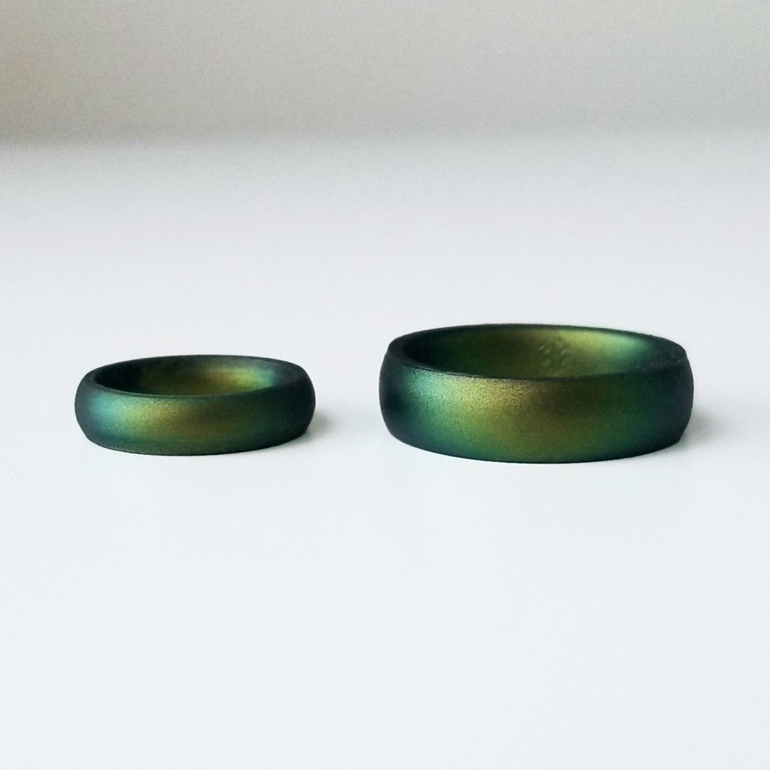 Northern Lights Green Breathable Silicone Ring showcasing its sleek bevel design and comfortable fit, suitable for both men and women.