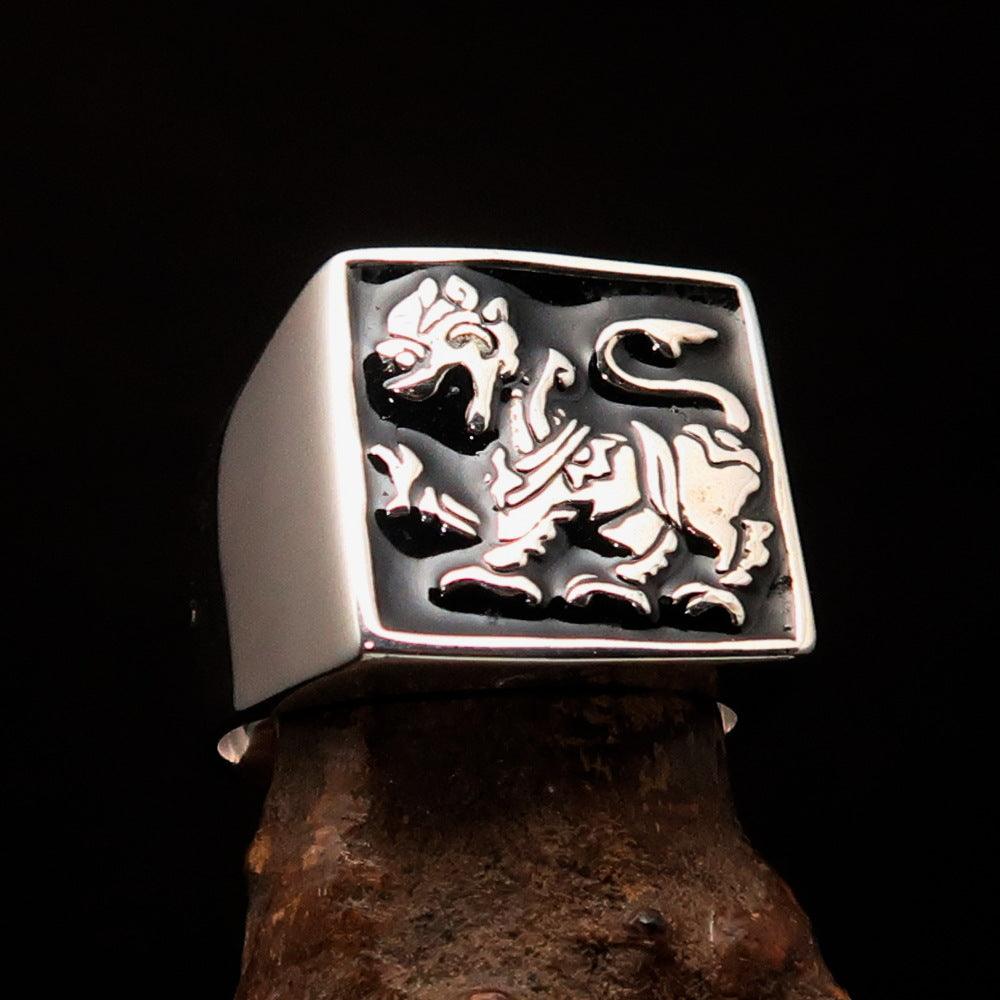 Men's black Sinhalese Lion Ring made of sterling silver with black enamel accents, featuring a detailed lion design.