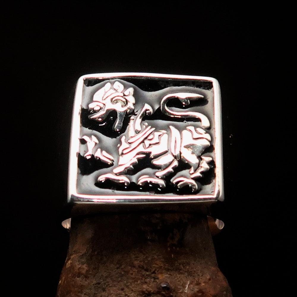 Men's black Sinhalese Lion Ring made of sterling silver with black enamel accents, featuring a detailed lion design.