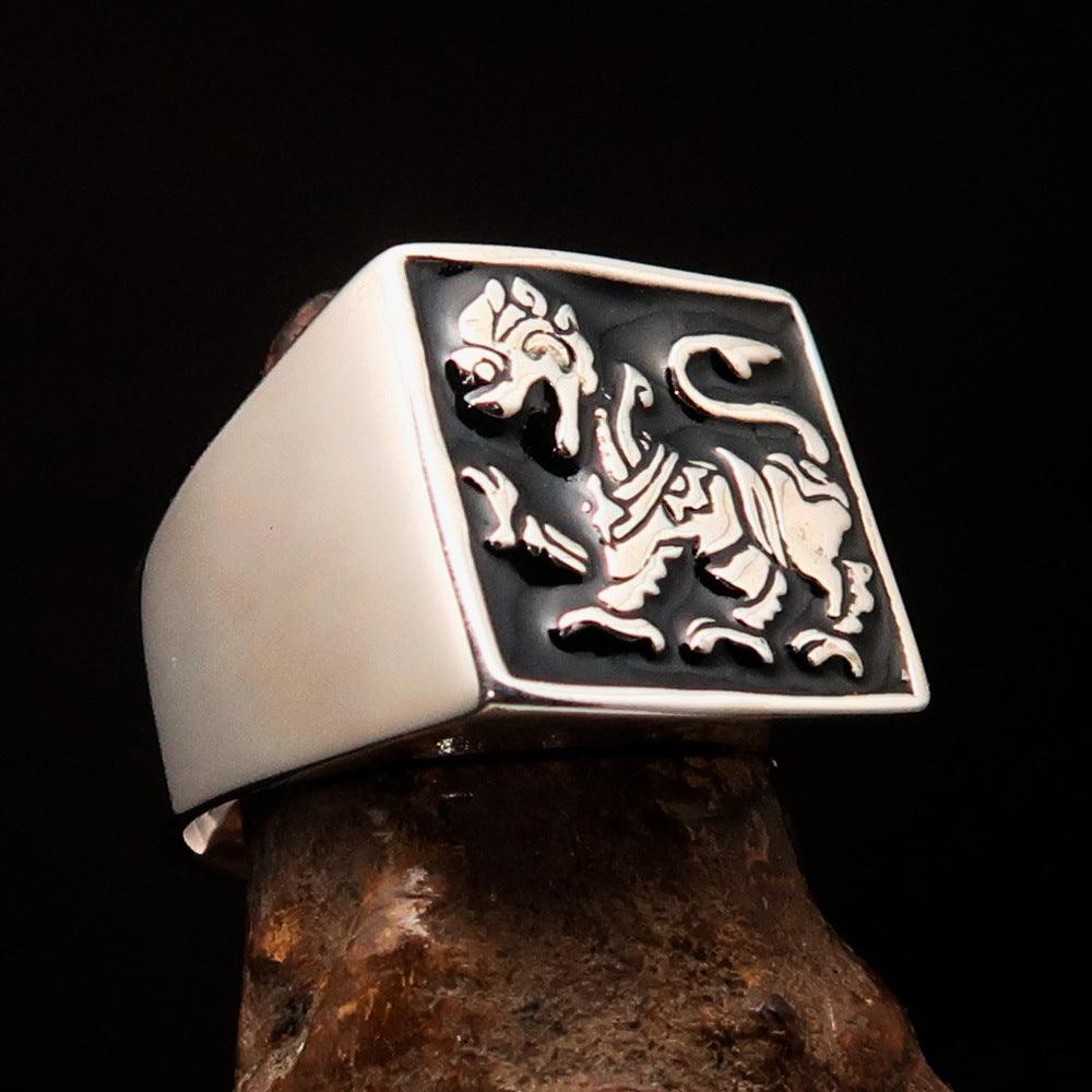 Men's black Sinhalese Lion Ring made of sterling silver with black enamel accents, featuring a detailed lion design.