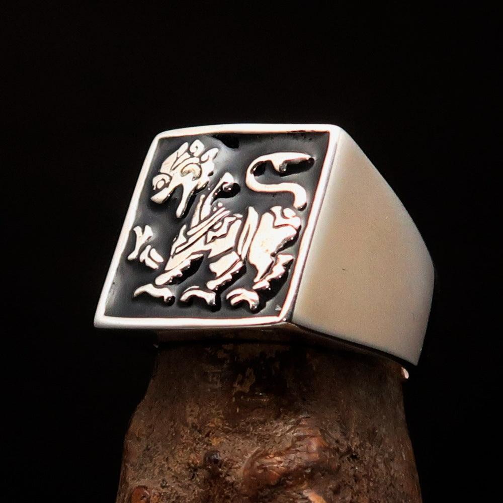 Men's black Sinhalese Lion Ring made of sterling silver with black enamel accents, featuring a detailed lion design.