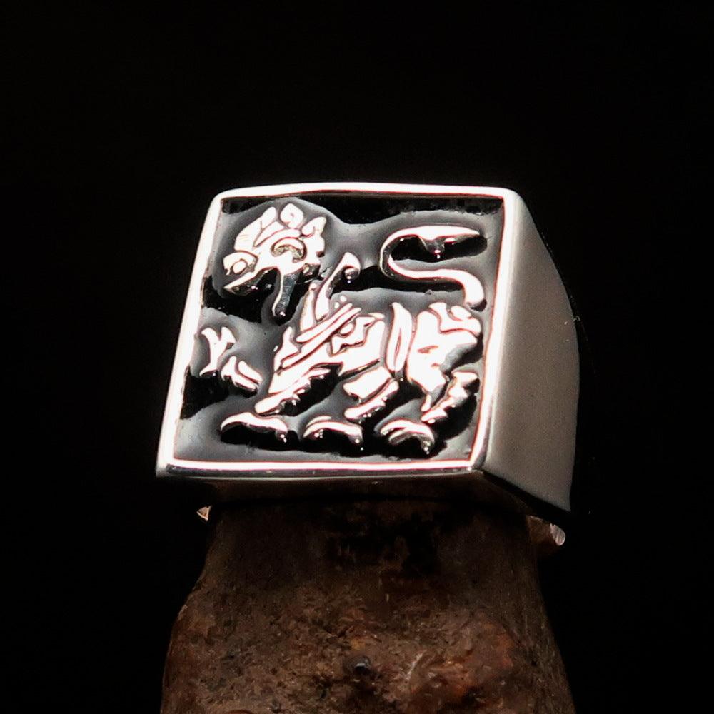 Men's black Sinhalese Lion Ring made of sterling silver with black enamel accents, featuring a detailed lion design.