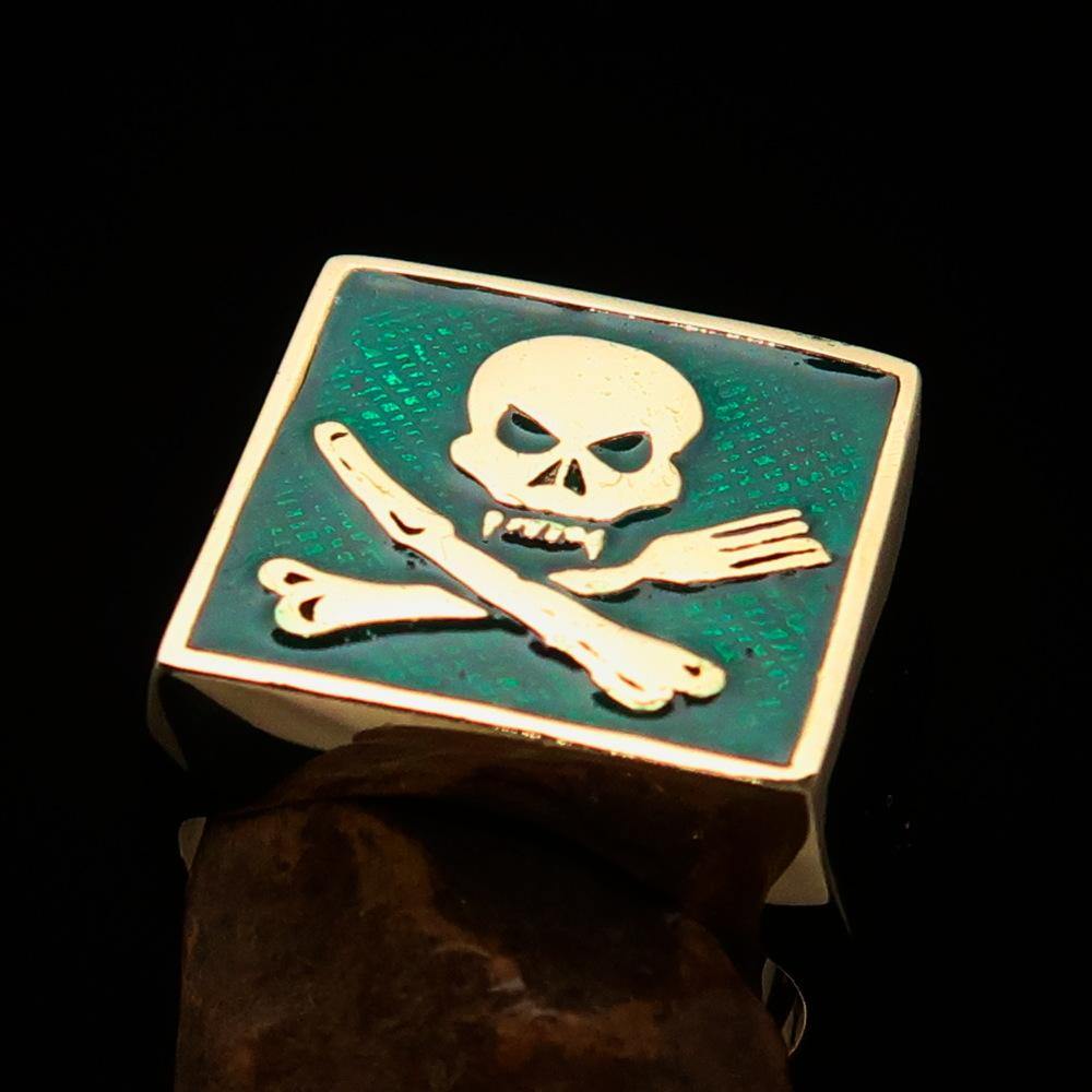 Men's Chef Skull Ring featuring crossed fork and knife design with green enamel finish, crafted from solid brass.