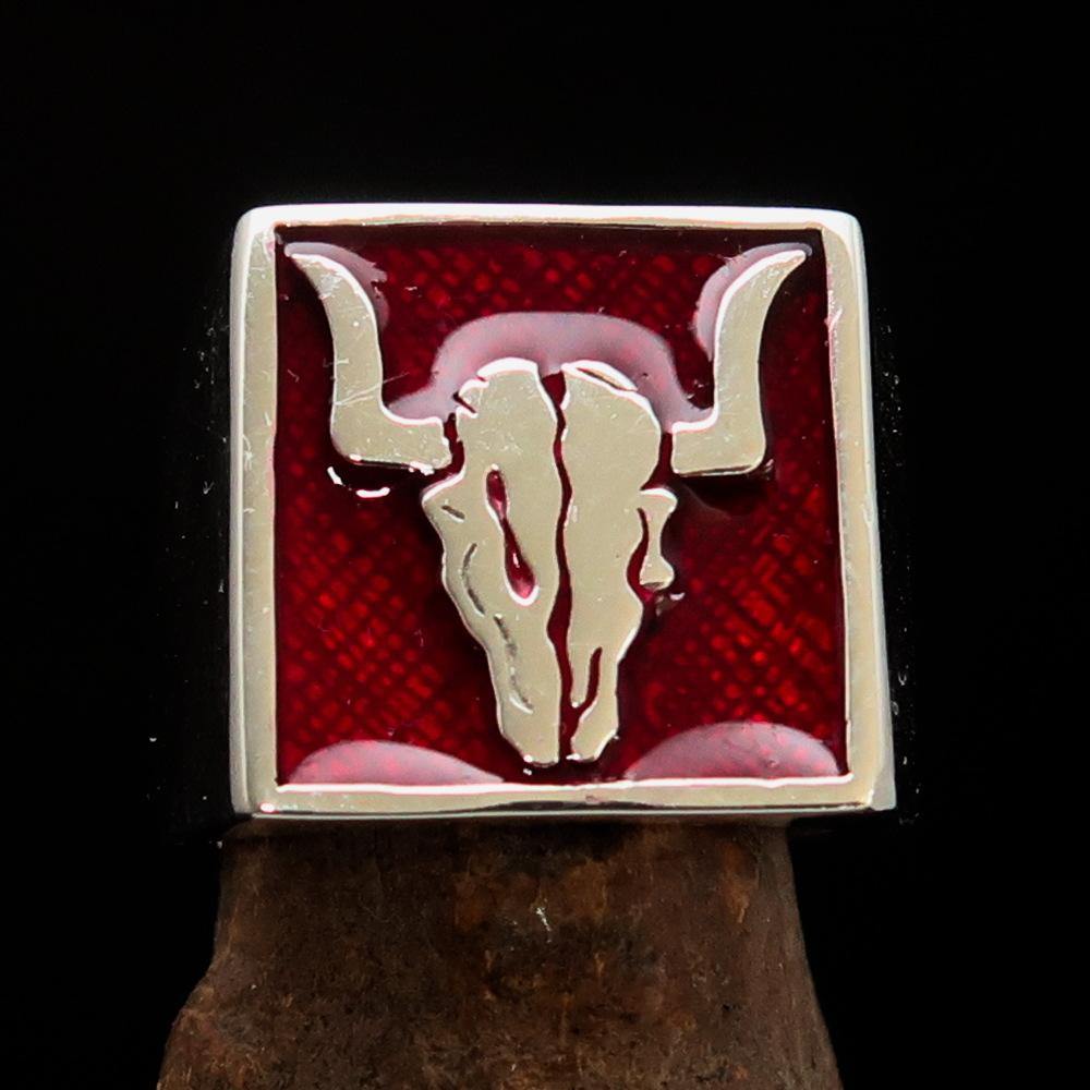 Men's Cowboy Ring featuring a detailed bull skull design in high polished sterling silver with red enamel accents.