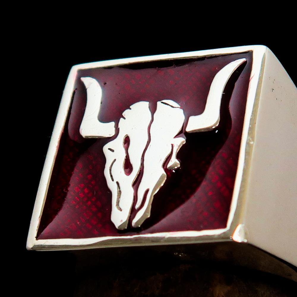 Men's Cowboy Ring featuring a detailed bull skull design in high polished sterling silver with red enamel accents.