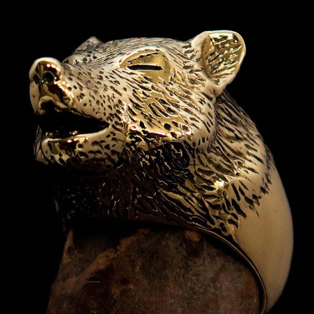 Men's Howling Wolf Pinky Ring in antiqued brass with intricate detailing and a vintage finish.