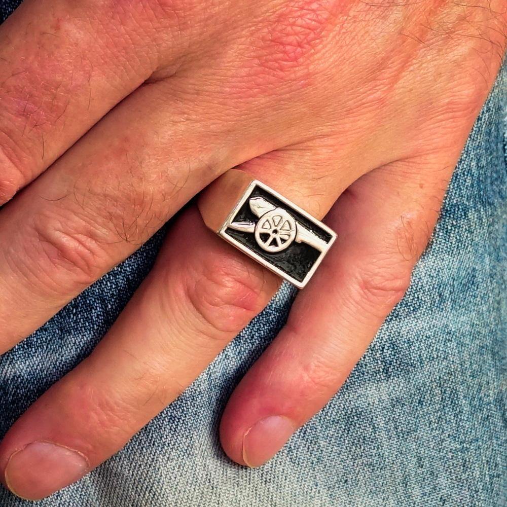 Men's Naval Cannon Ring made of solid sterling silver with high polish and black enamel finish, showcasing its unique design and craftsmanship.