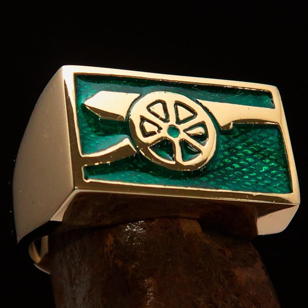 Men's Naval Cannon Ring made of solid brass with a high-polished finish and vibrant green enamel, showcasing its unique design and craftsmanship.