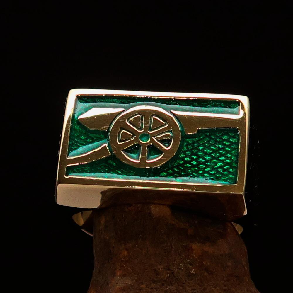 Men's Naval Cannon Ring made of solid brass with a high-polished finish and vibrant green enamel, showcasing its unique design and craftsmanship.