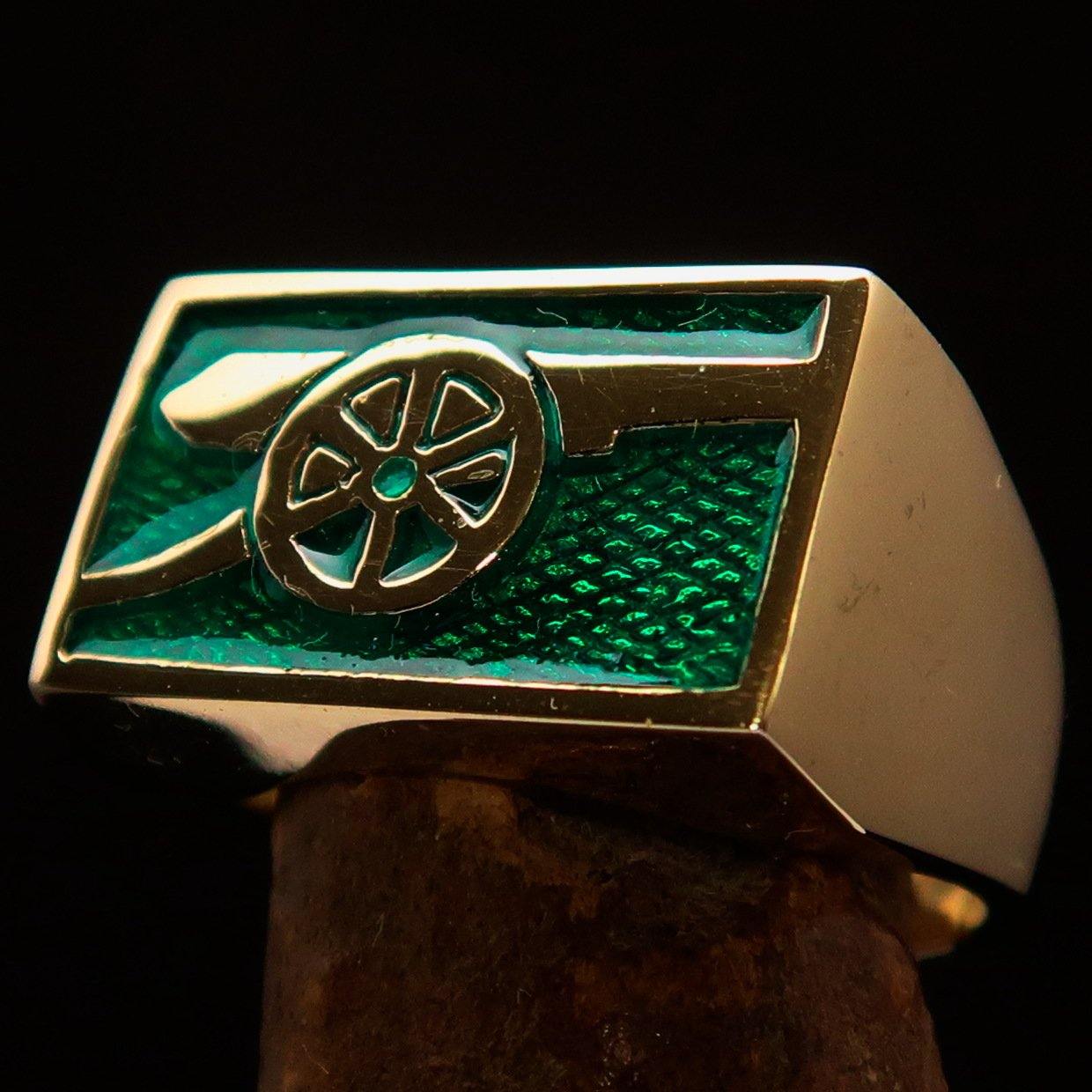 Men's Naval Cannon Ring made of solid brass with a high-polished finish and vibrant green enamel, showcasing its unique design and craftsmanship.