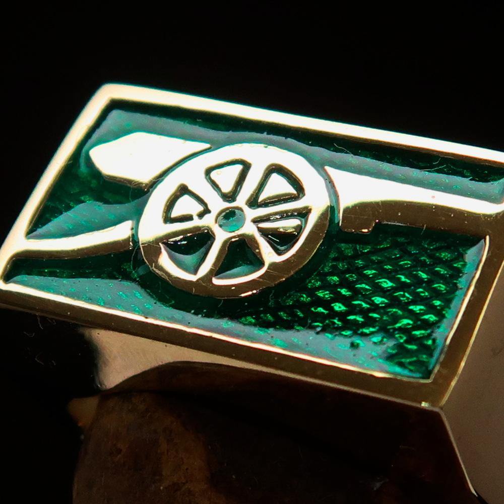 Men's Naval Cannon Ring made of solid brass with a high-polished finish and vibrant green enamel, showcasing its unique design and craftsmanship.