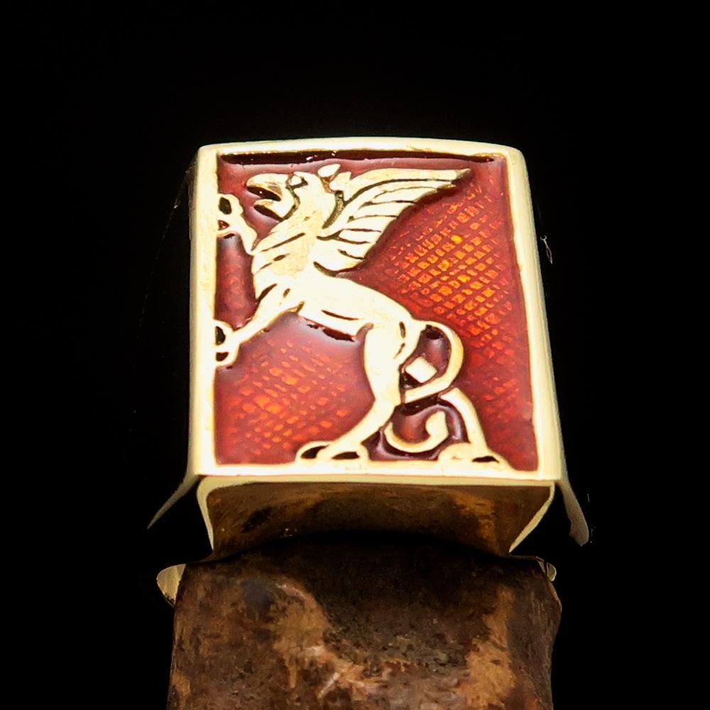 Men's Orange Griffin Ring made of solid brass with vibrant orange enamel, showcasing a polished finish and griffin design.