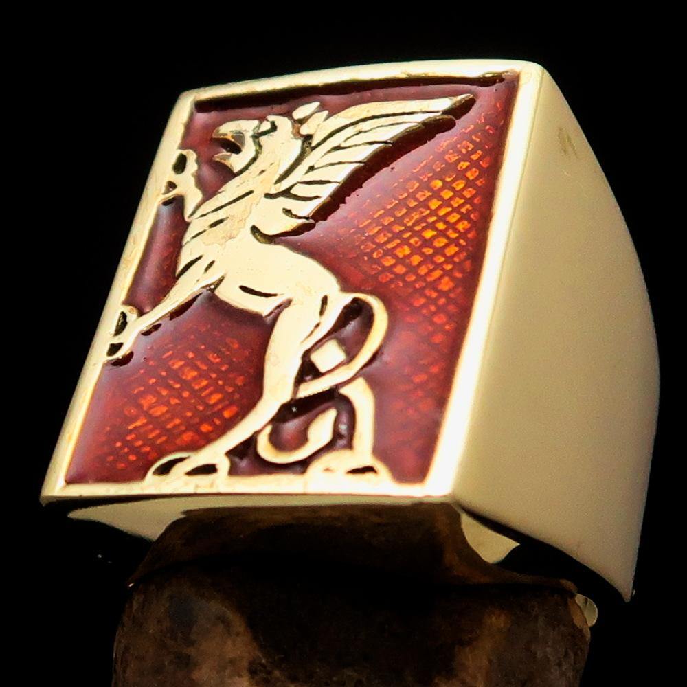 Men's Orange Griffin Ring made of solid brass with vibrant orange enamel, showcasing a polished finish and griffin design.