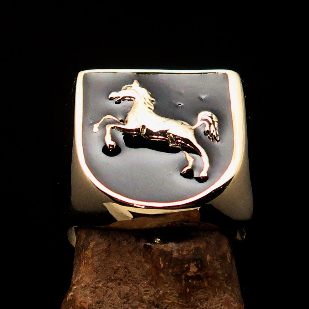 A beautifully crafted men's ring made of solid brass featuring a Horse Coat of Arms design, finished with black enamel for a sleek look.