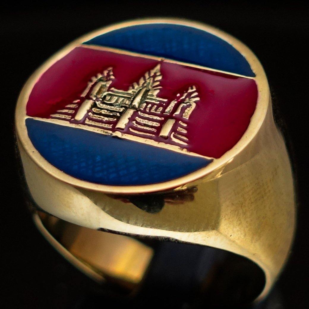 Men's round flag ring made of solid brass with blue and red enamel, showcasing a polished finish and unique design.