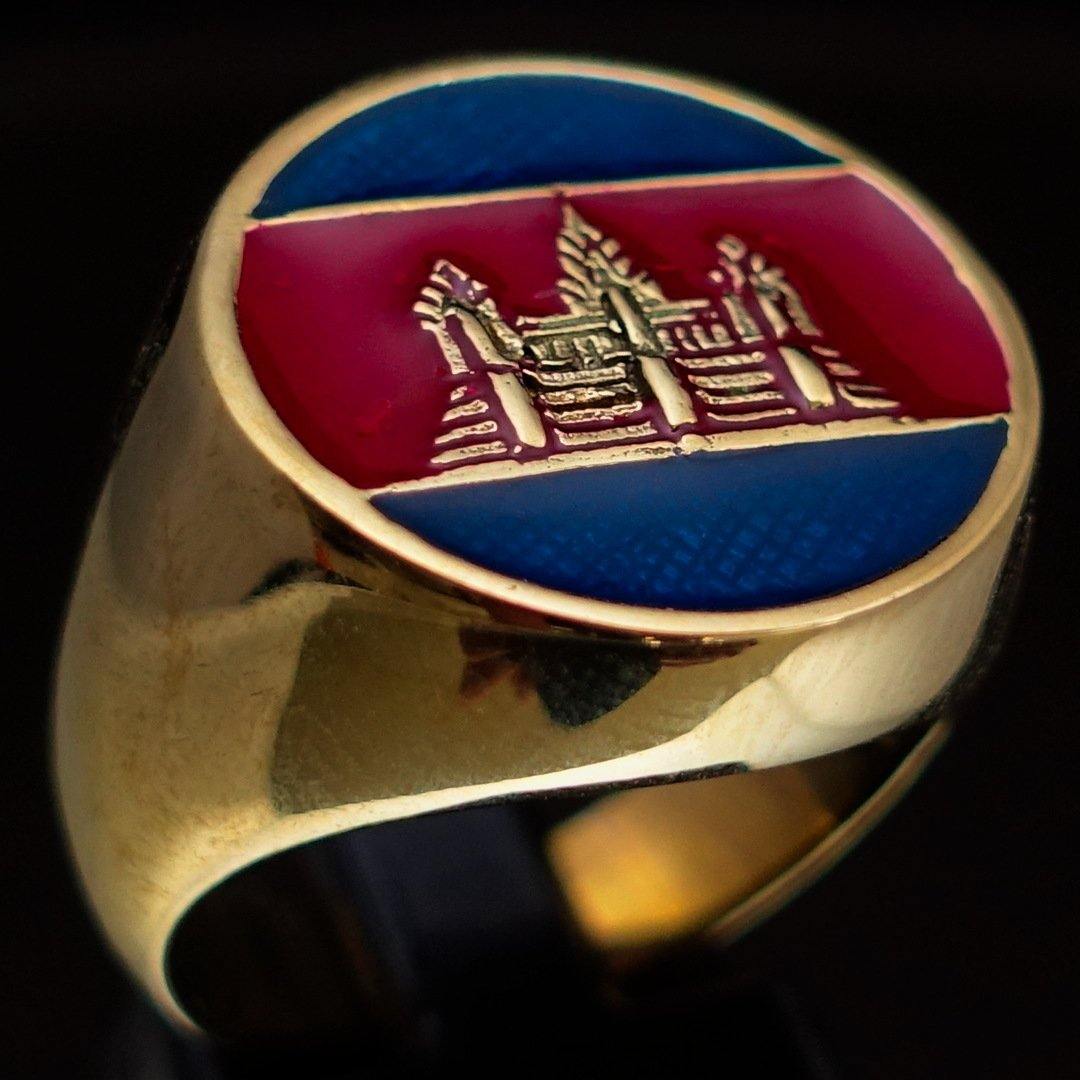 Men's round flag ring made of solid brass with blue and red enamel, showcasing a polished finish and unique design.