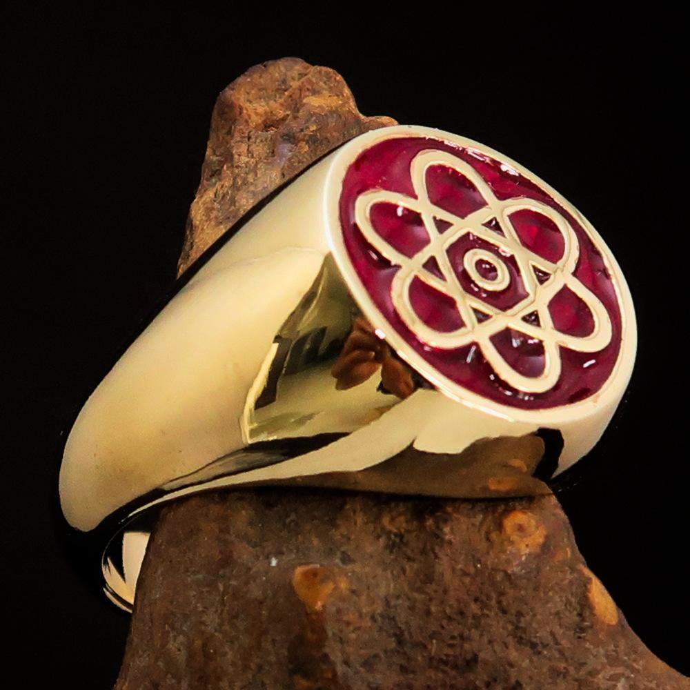 Men's Teacher Ring featuring Atom Symbol in solid brass with red enamel finish, showcasing its polished surface and unique design.