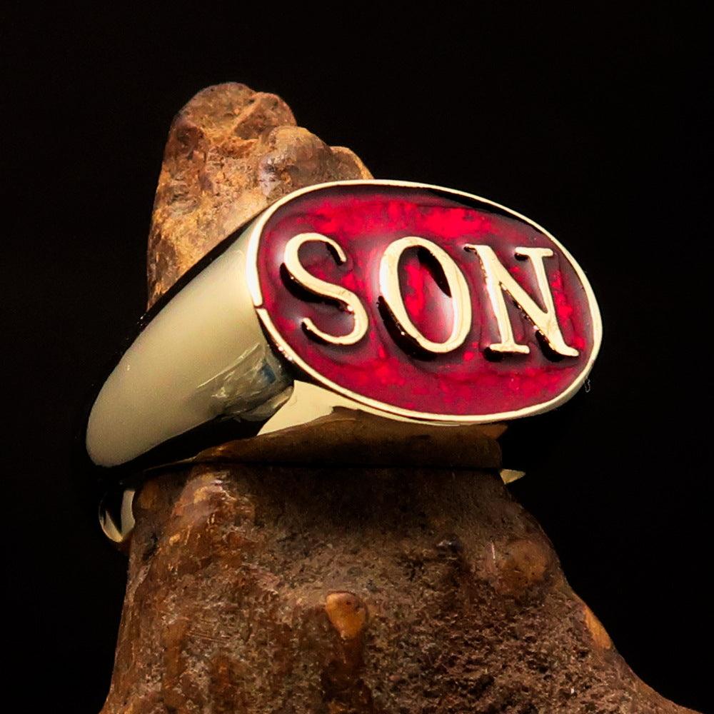 A high-polished solid brass men's pinky ring featuring a red enamel design with the initials 'SON', elegantly crafted for style and comfort.