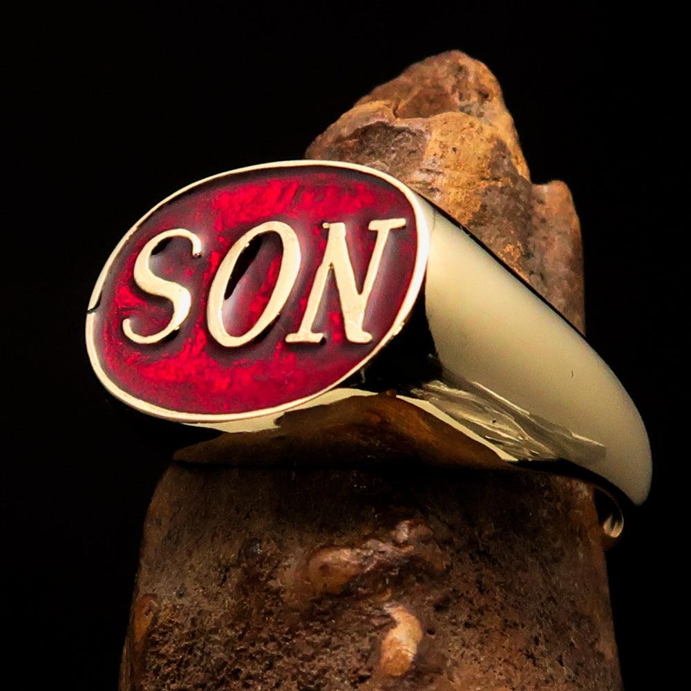 A high-polished solid brass men's pinky ring featuring a red enamel design with the initials 'SON', elegantly crafted for style and comfort.