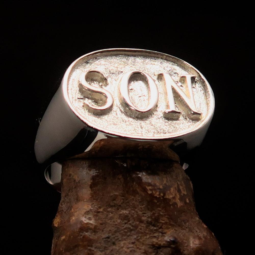 A two-tone oval initial men's ring made of solid sterling silver, featuring a high polished and matte finish with the initial 'SON'.