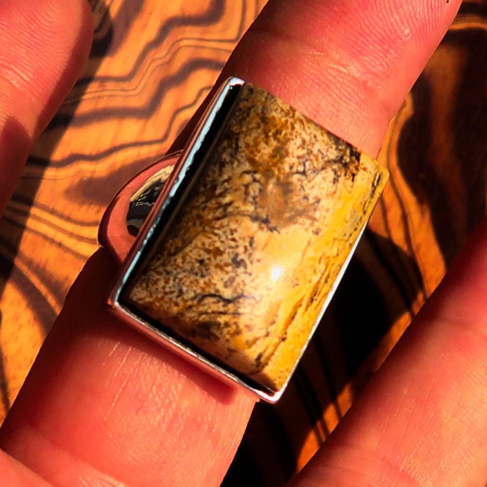 Rectangle shaped sterling silver ring featuring a brown Picture Jasper stone, hallmarked 925, showcasing its elegant design.