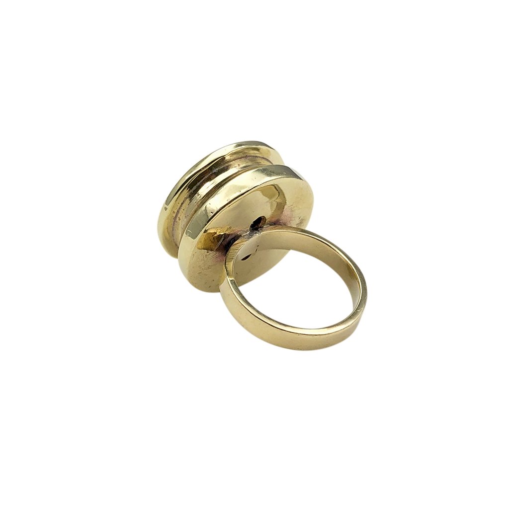 Recycled Bullet Ring made from polished brass bombshells, showcasing unique craftsmanship and design, symbolizing peace and resilience.