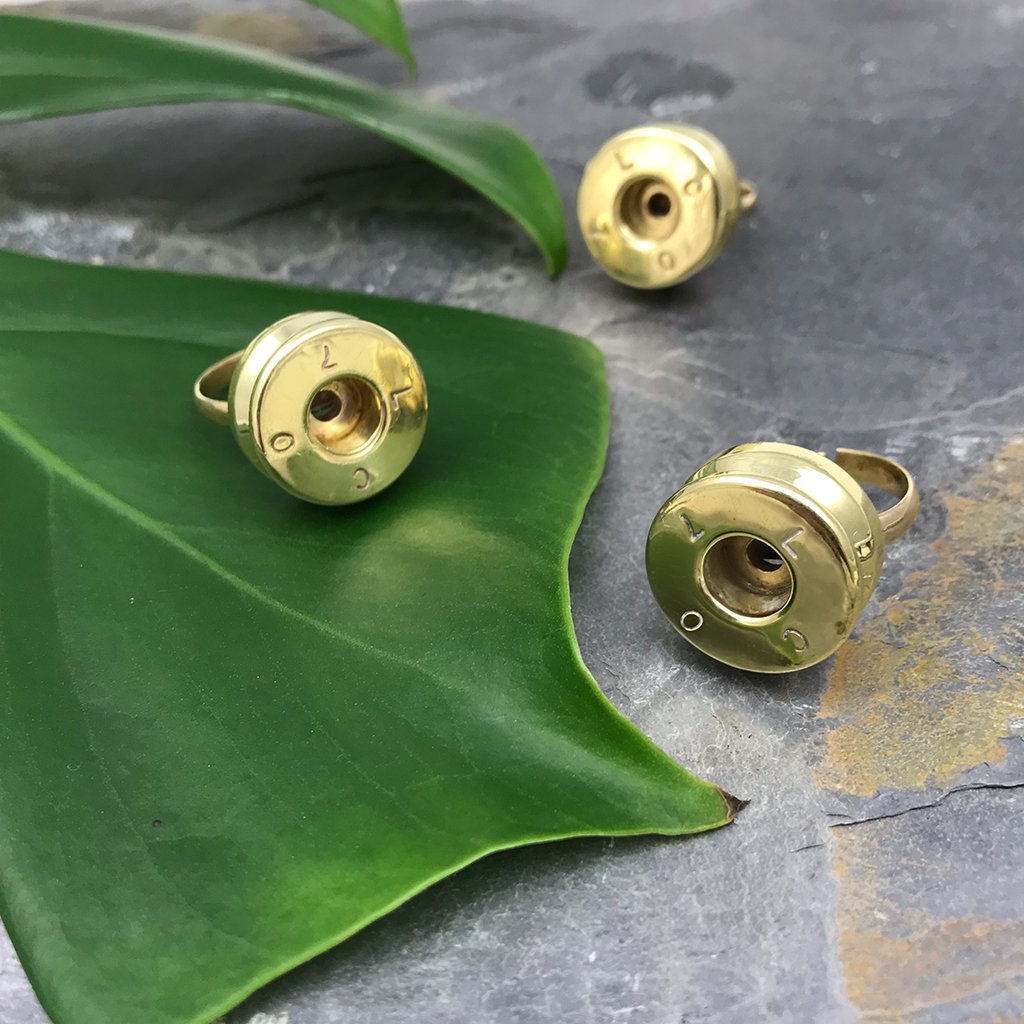 Recycled Bullet Ring made from polished brass bombshells, showcasing unique craftsmanship and design, symbolizing peace and resilience.