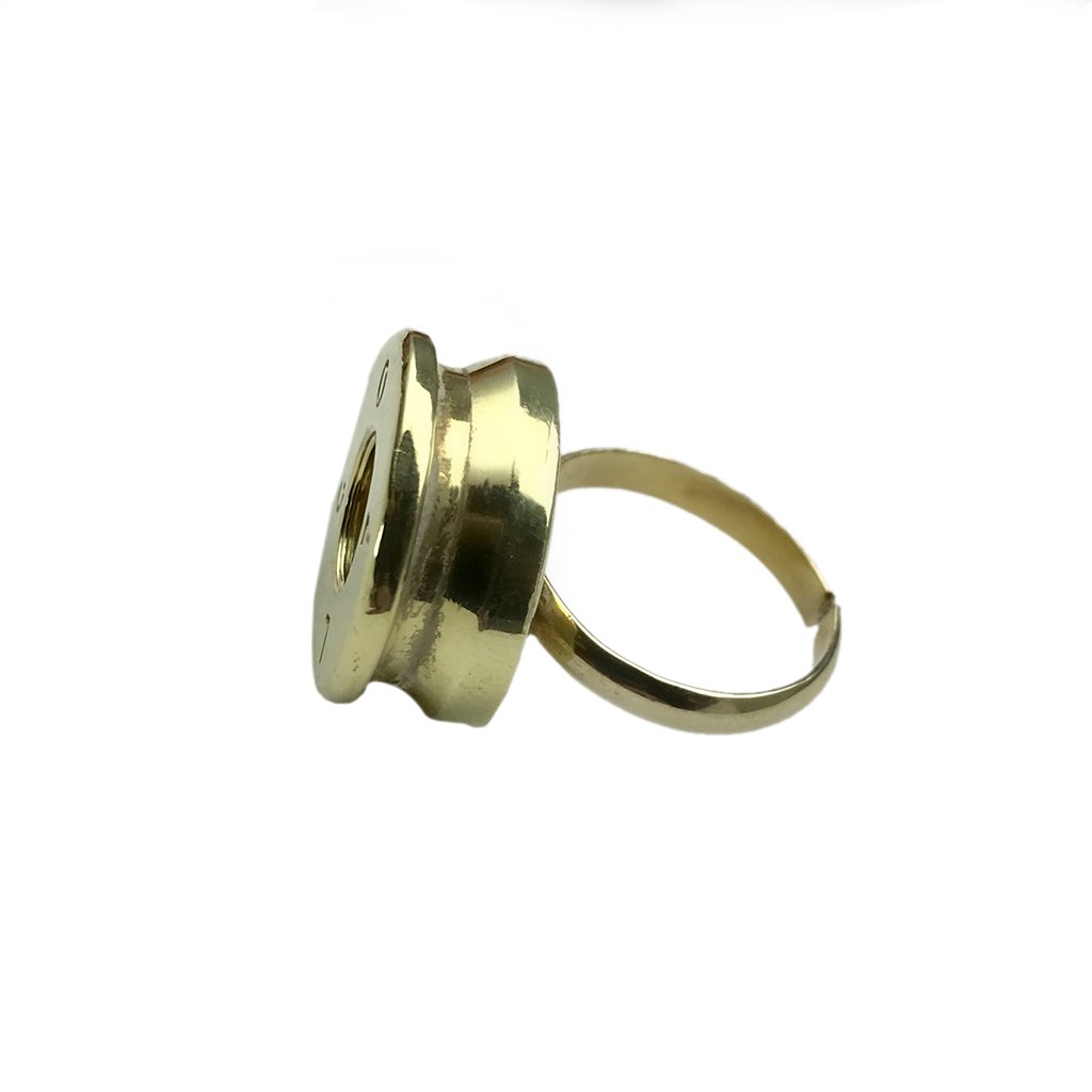 Recycled Bullet Ring made from polished brass bombshells, showcasing unique craftsmanship and design, symbolizing peace and resilience.