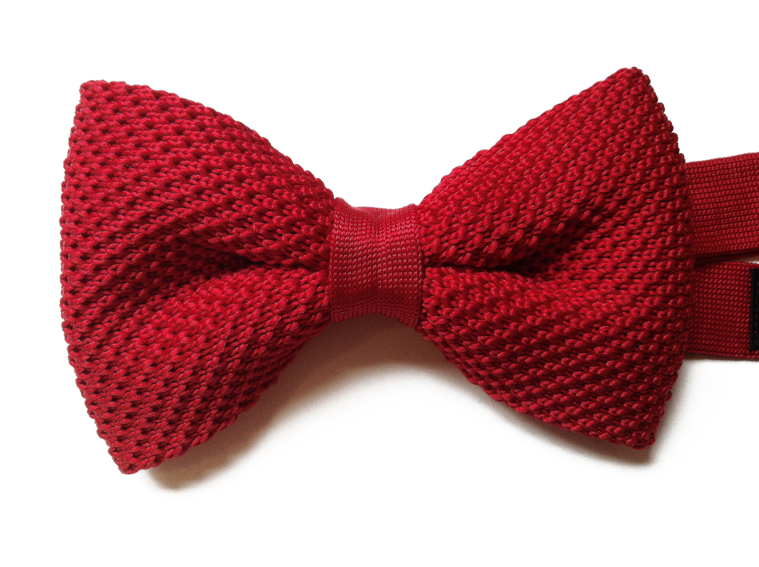 A vibrant red knit pre-tied bow tie, showcasing its unique texture and stylish design, perfect for formal and casual occasions.