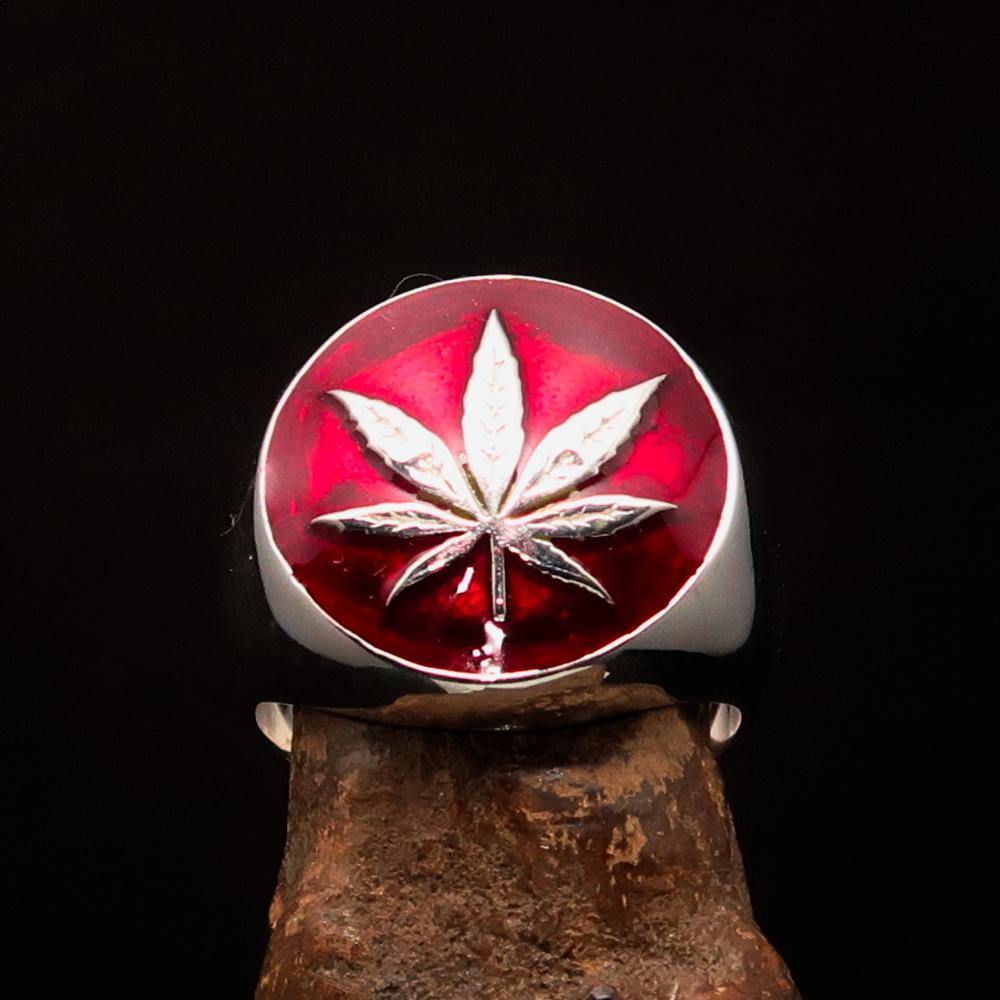 Sterling Silver Men's Ring featuring a Marihuana Cannabis Leaf design with red enamel accents, showcasing a polished finish.