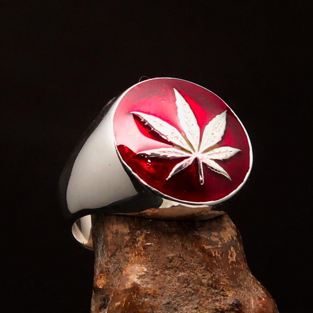 Sterling Silver Men's Ring featuring a Marihuana Cannabis Leaf design with red enamel accents, showcasing a polished finish.