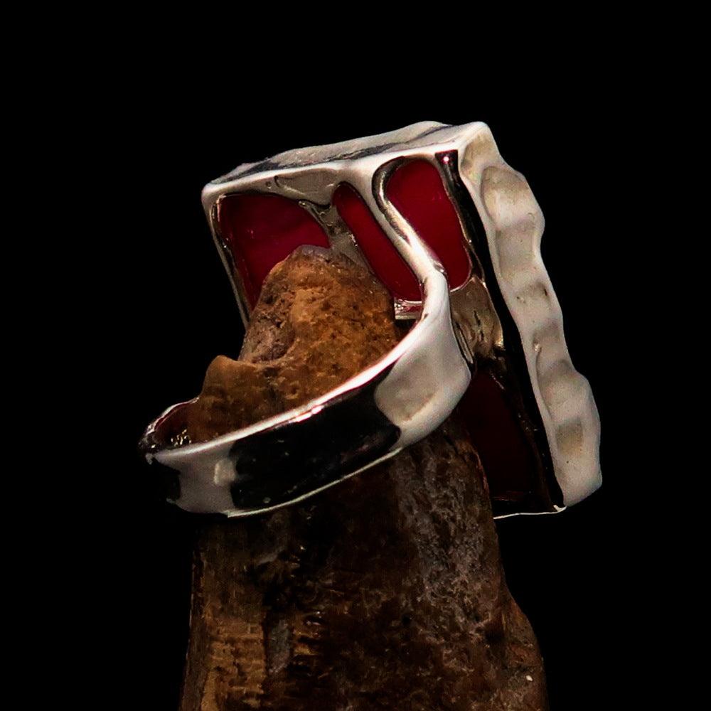 A beautifully crafted Sterling Silver Ring featuring a rectangle-shaped pink Agate Cabochon, showcasing its polished finish and vibrant color.