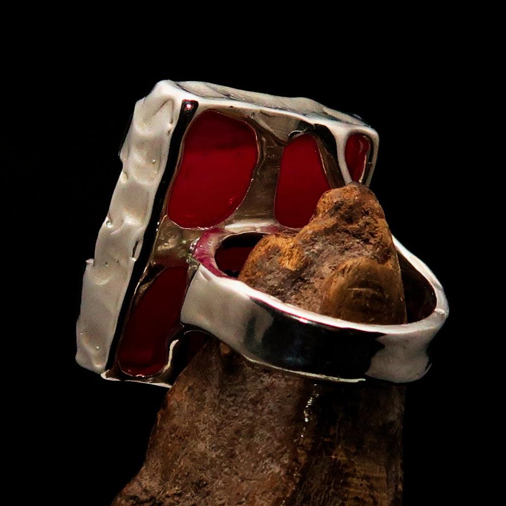 A beautifully crafted Sterling Silver Ring featuring a rectangle-shaped pink Agate Cabochon, showcasing its polished finish and vibrant color.