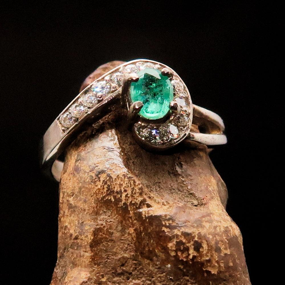 Sterling Silver Solitaire Ring featuring an oval Green Emerald and 13 white Cubic Zirconia stones, polished to a mirror finish.