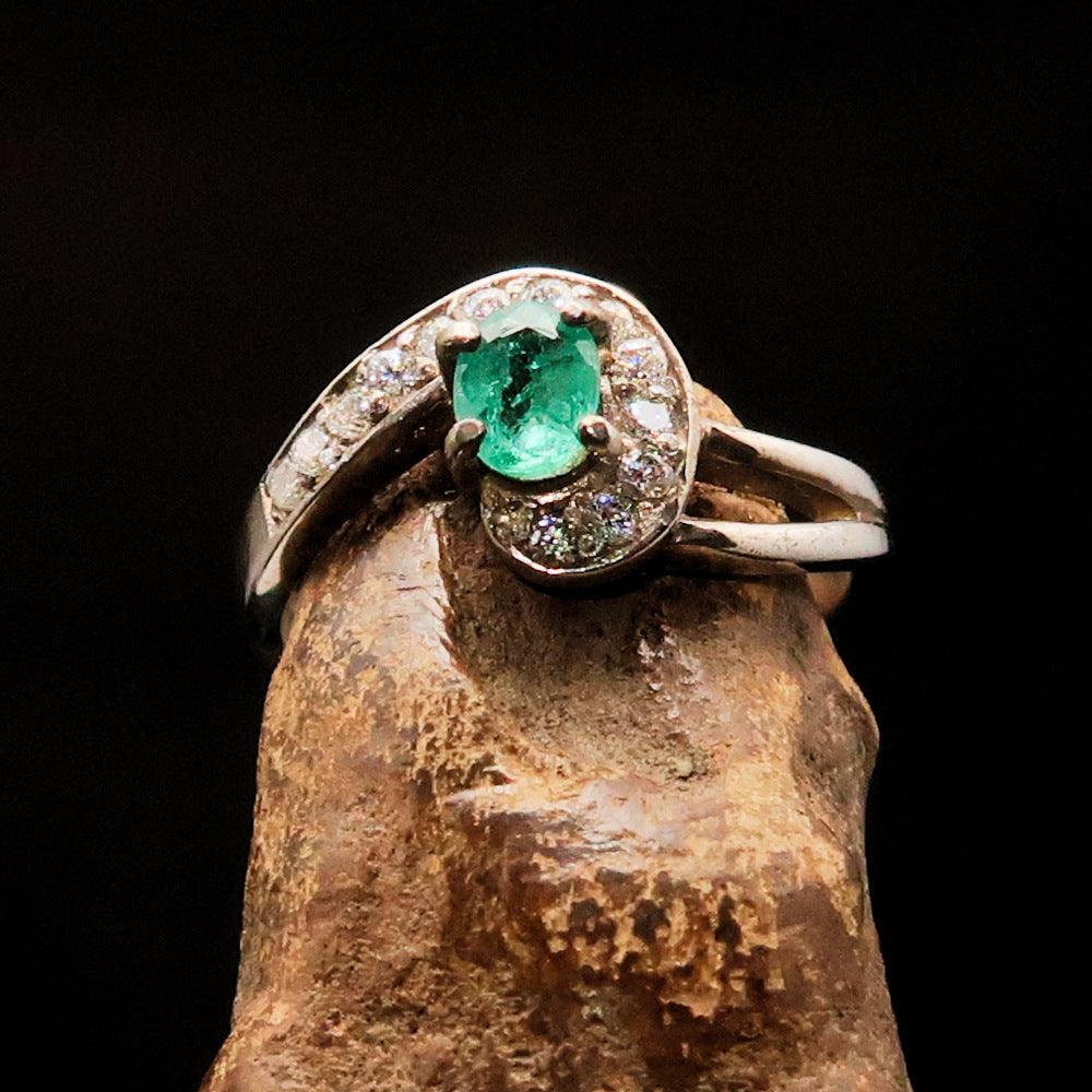 Sterling Silver Solitaire Ring featuring an oval Green Emerald and 13 white Cubic Zirconia stones, polished to a mirror finish.