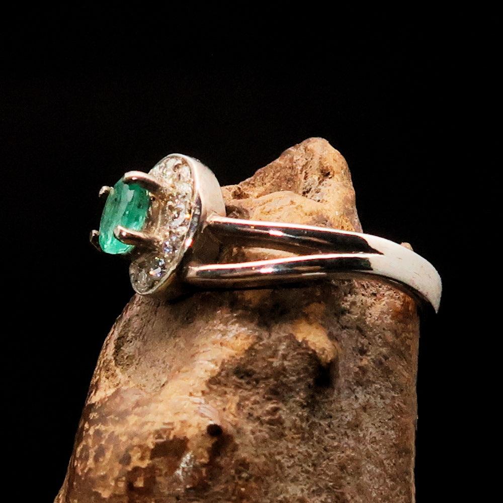 Sterling Silver Solitaire Ring featuring an oval Green Emerald and 13 white Cubic Zirconia stones, polished to a mirror finish.