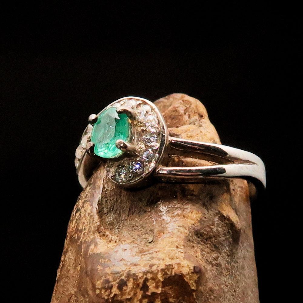 Sterling Silver Solitaire Ring featuring an oval Green Emerald and 13 white Cubic Zirconia stones, polished to a mirror finish.