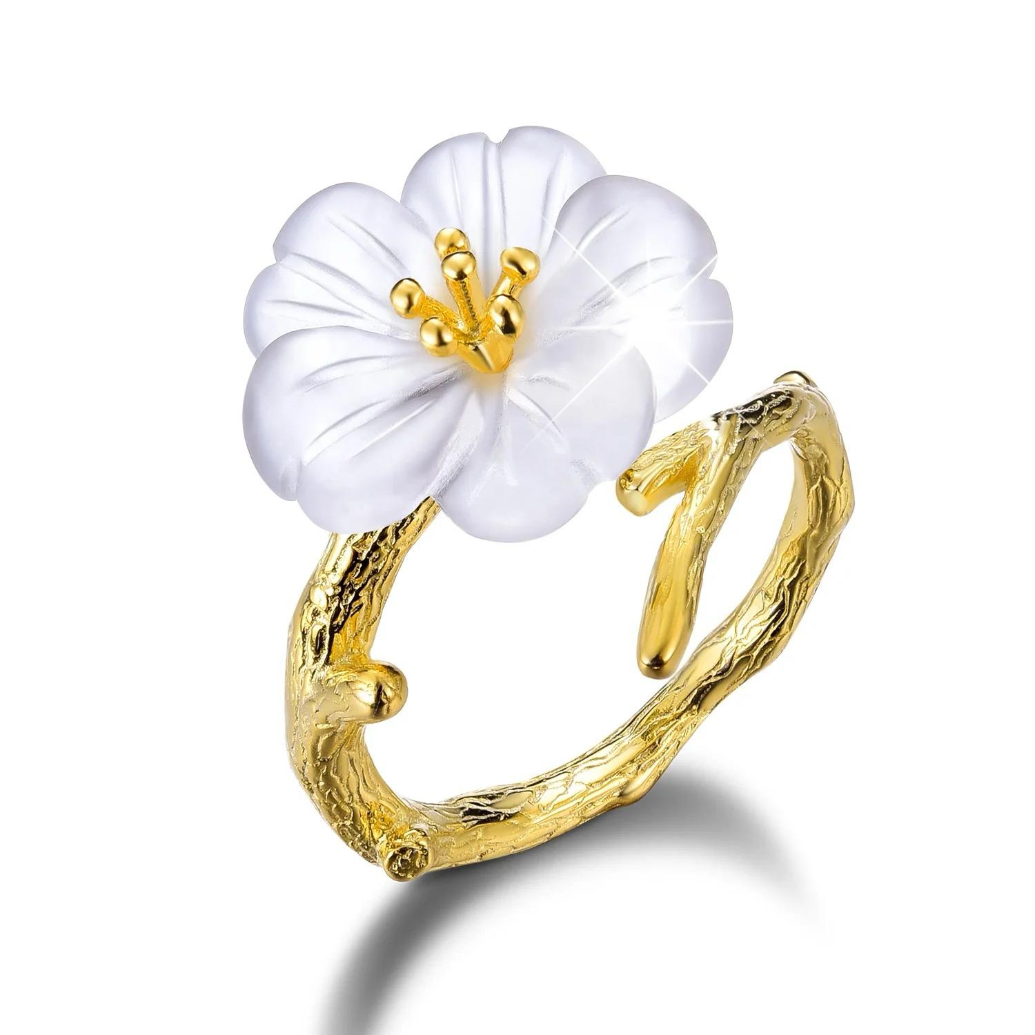 Sylvan Blossom Ring featuring a delicate flower design in 925 sterling silver with an 18K gold-plated leaf.