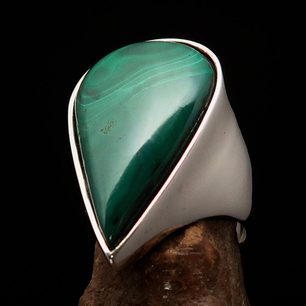 Tear shaped mirror polished sterling silver ring featuring a pear shaped green malachite stone, showcasing its elegant design and craftsmanship.