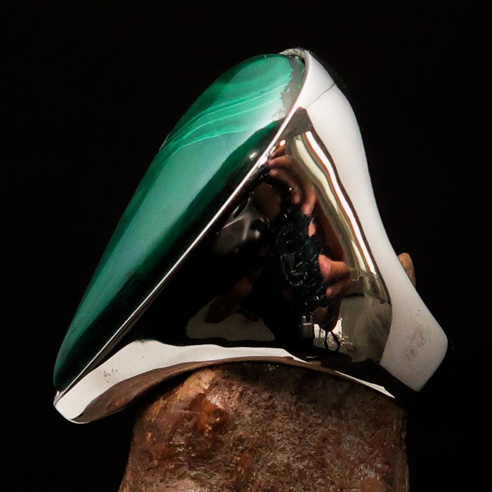 Tear shaped mirror polished sterling silver ring featuring a pear shaped green malachite stone, showcasing its elegant design and craftsmanship.